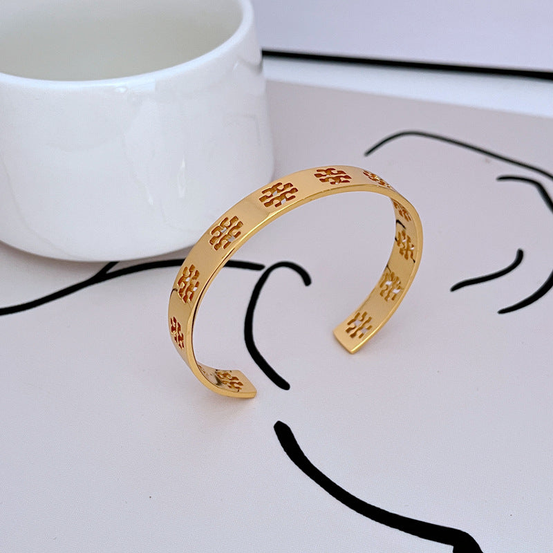 Tory Burch Commuter Style Openwork Logo Metal Bangle