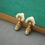 Fan-shaped pearl earrings with gold accents and dangling teardrop pearl drops, stud style