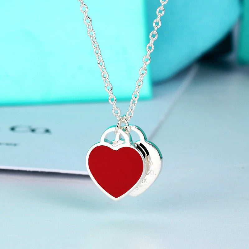 Enamel double heart pendant necklace with red heart charm and silver-tone chain