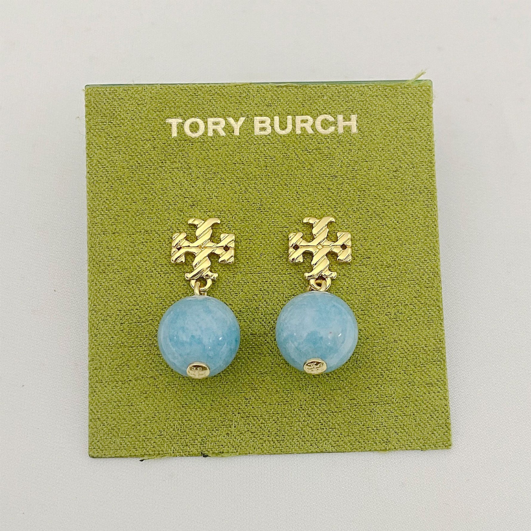 Blue agate pendant earrings with gold logo stud and round bead drop
