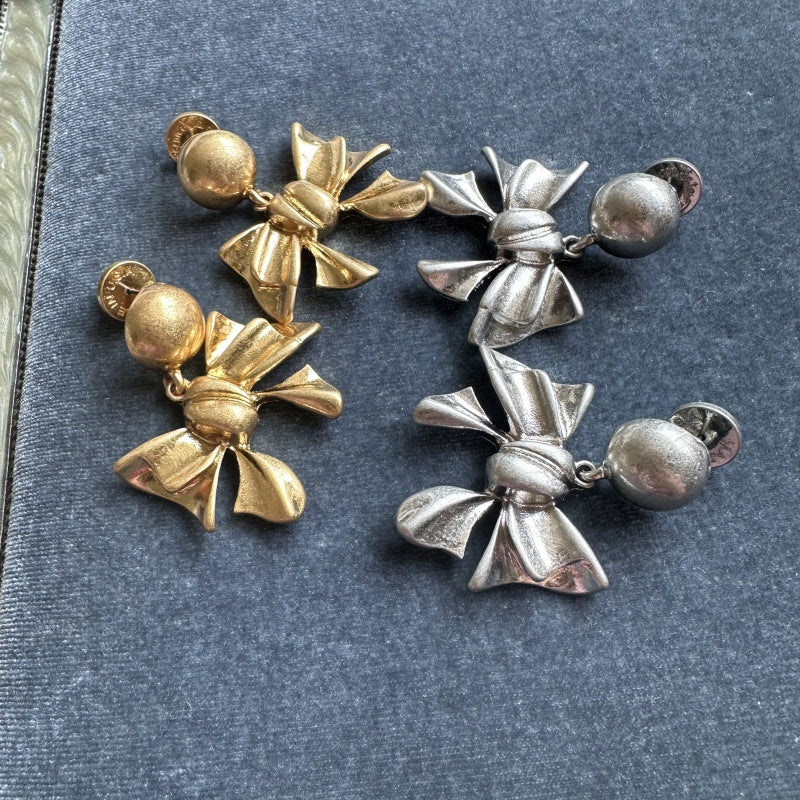 Gold-tone bow drop earrings with ball stud backs