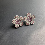 Diamond colorful floral stud earrings in silver with red and pink stones
