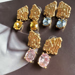 Gold-tone crystal drop earrings with blue, amber, and pink stones