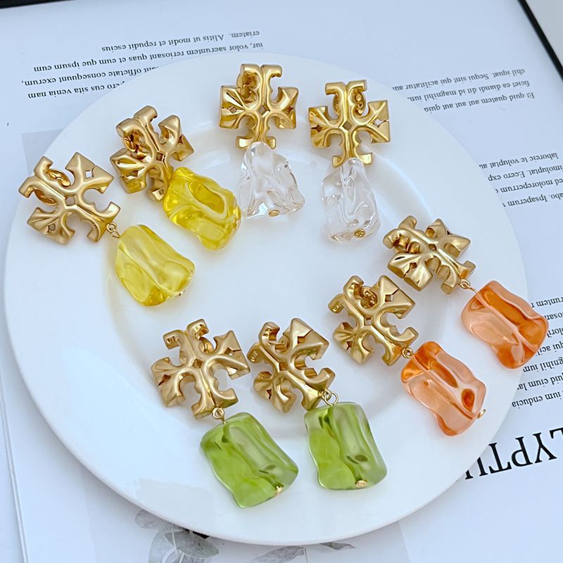 Acrylic logo pendant earrings set, gold charms with yellow, orange, green, and clear pieces