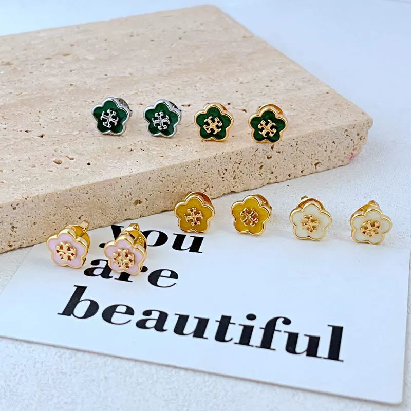 Enamel flower stud earrings set, gold-tone with green and white petals and red motifs