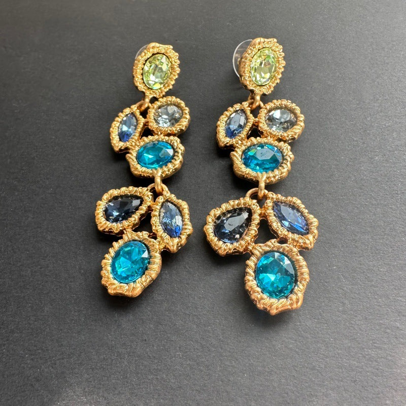 Long blue crystal drop earrings, gold-tone ornate clusters