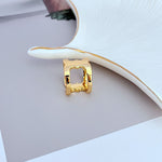 Front view of wide polished gold ring with heart-shaped opening and cutout details