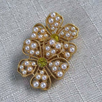 White pearl and yellow diamond floral stud earrings with gold openwork petals