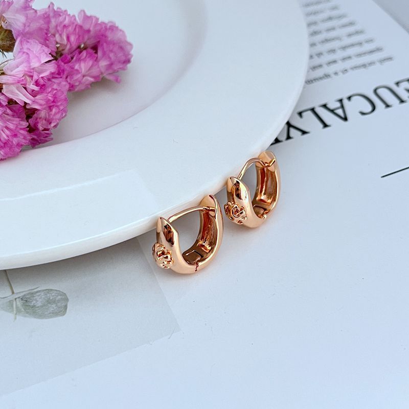 Petite U-shaped hoop earrings, rose gold tone, smooth curved shape