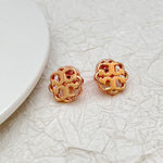 Rose gold-tone openwork floral logo stud earrings with curved metal edges