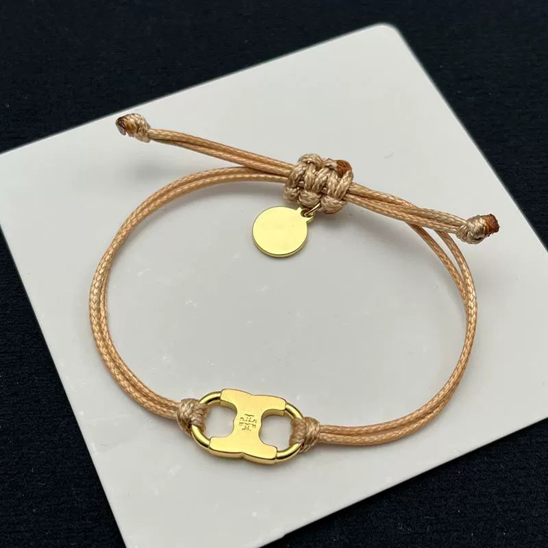 Pulsera con cordón beige ajustable y dije esmaltado amarillo con aro dorado