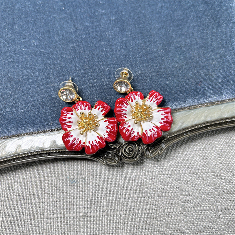 Vintage enamel cherry blossom earrings in red and white with gold beaded floral centers