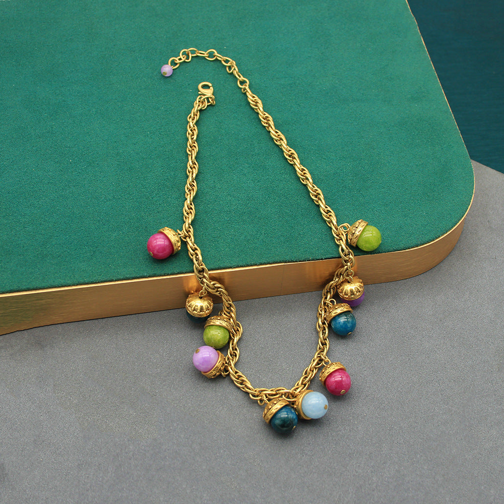 Gold-tone vintage beaded bracelet with multicolor round stone charms and links