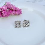 White gold square stud earrings with openwork rhinestones and cutout center