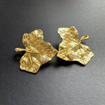 Gold-tone ivy leaf pearl earrings with textured leaf detailing and white pearls