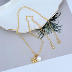 Tory Burch logo pearl pendant necklace, gold-tone chain with round pearl charm