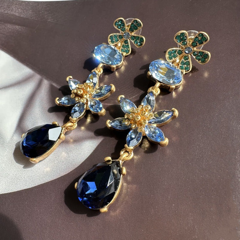 Blue crystal floral drop earrings with green clover studs and pear teardrop dangles