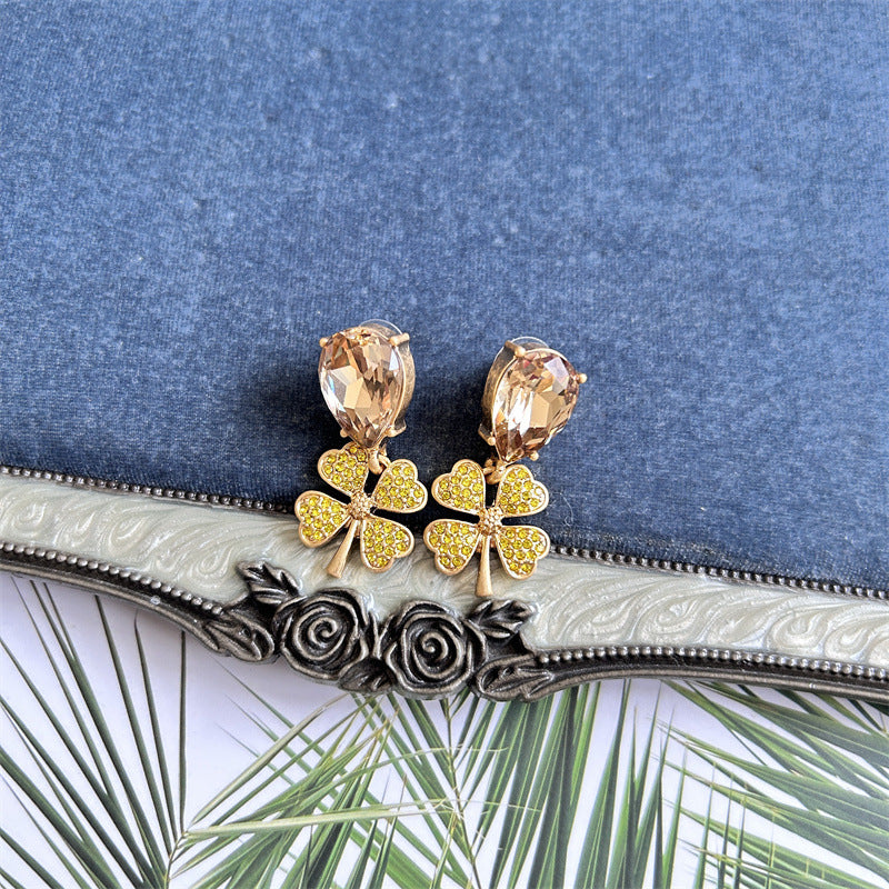 Vintage four-leaf clover earrings with champagne oval stones and yellow-gold pavé clover petals