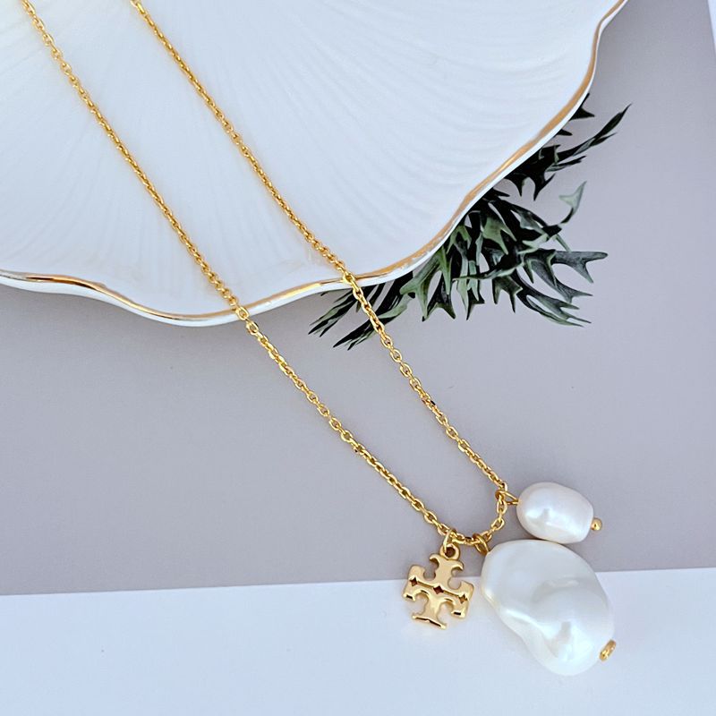 Gold-tone pendant necklace with two white baroque pearls and logo charm