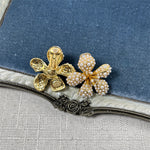 Gold-tone five-petal flower earrings with white pearls and crystal accents
