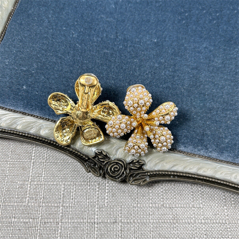 Gold-tone five-petal flower earrings with white pearls and crystal accents