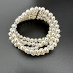 Multi-row pearl stretch bracelet with rhinestone accent strip between rows