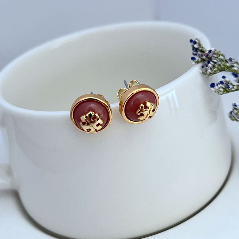 Round logo resin stud earrings, burgundy red center with gold-tone bezel
