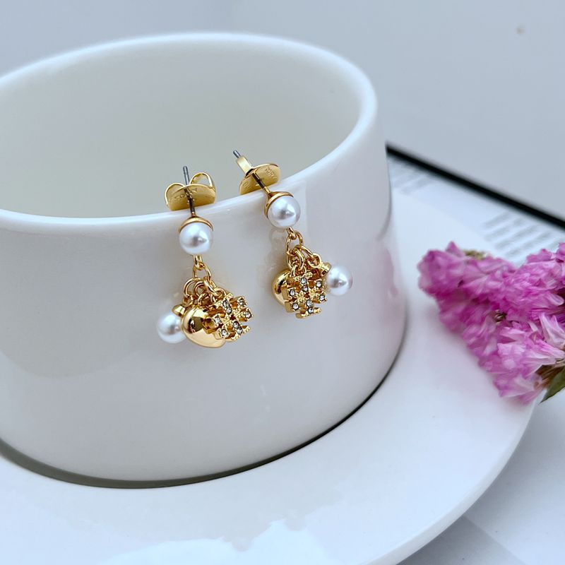 Gold-tone heart dangle earrings with rhinestone details and pearl drops