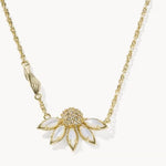 Gold-tone daisy flower pendant necklace with yellow-green rhinestone center and pale petals