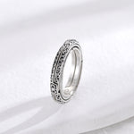 Silver astronomical magic ring, ornate engraved outer band side view