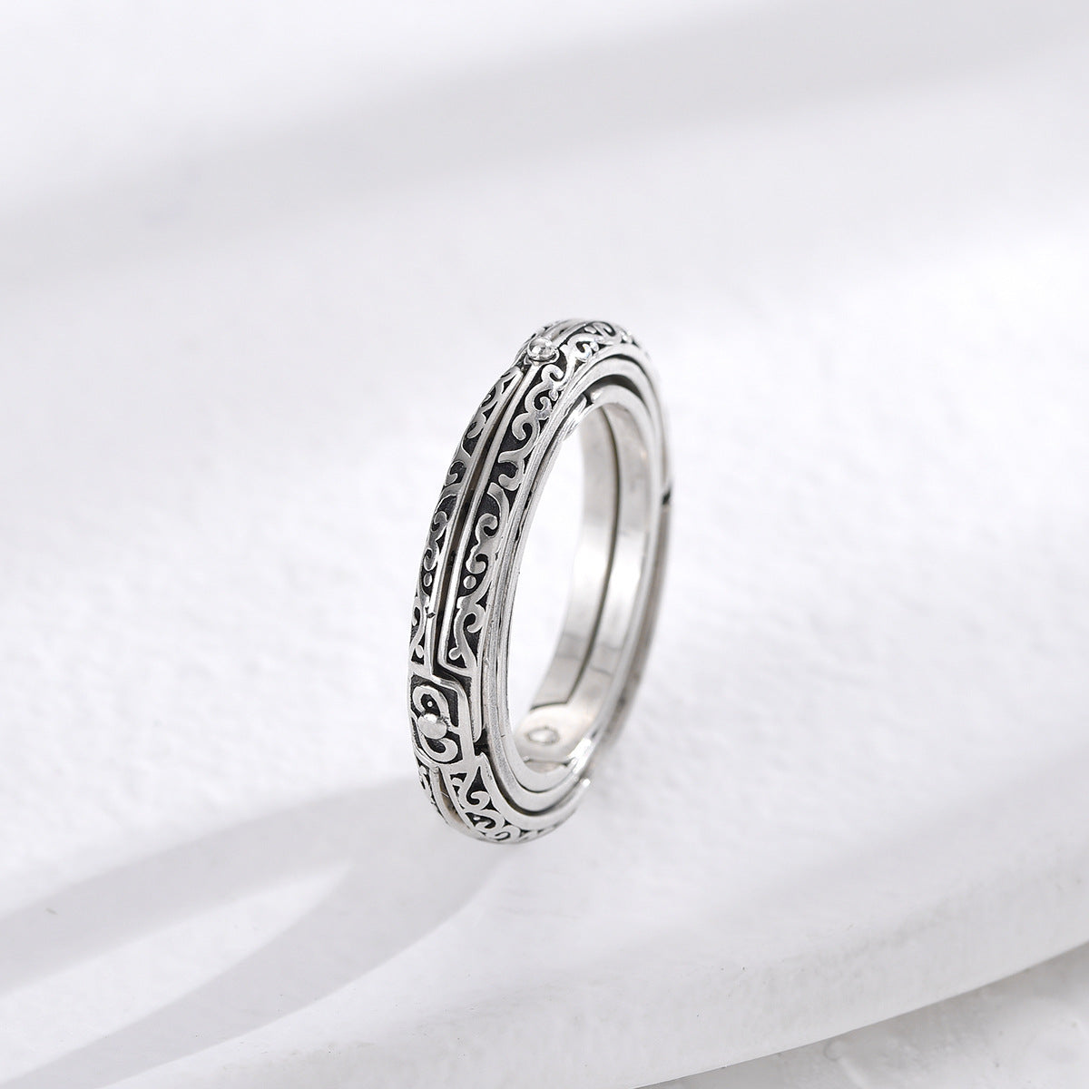 Silver astronomical magic ring, ornate engraved outer band side view