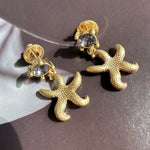 Oscar de la Renta vintage gold starfish stud earrings with clear light crystals
