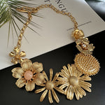 Vintage enamel daisy flower necklace with gold-tone chain and large daisy pendants