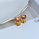 Geometric square stud earrings with rose-pink rhinestones and gold-tone posts