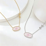 Gold- and silver-tone oval pendant bow necklaces with pink floral enamel