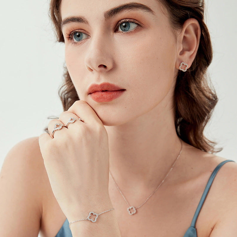 Sterling silver clover bracelet with openwork four-leaf charm on the wrist