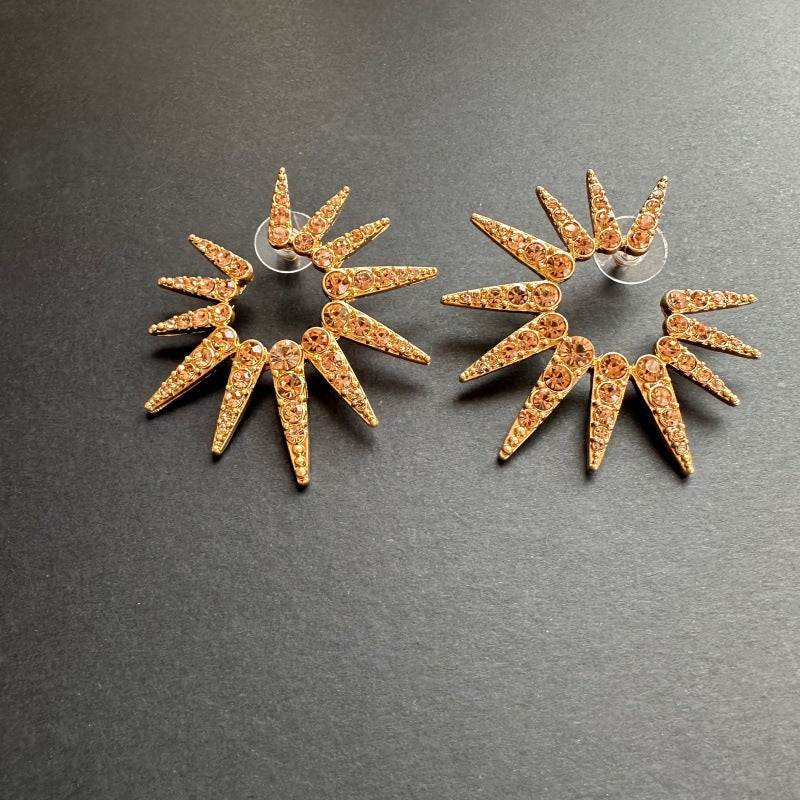 Champagne diamond starburst sunflower earrings with warm gold-tone sparkle stones