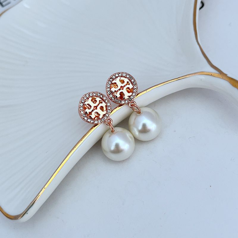 Round logo pearl drop earrings with rose-gold tone discs and white pearl drops