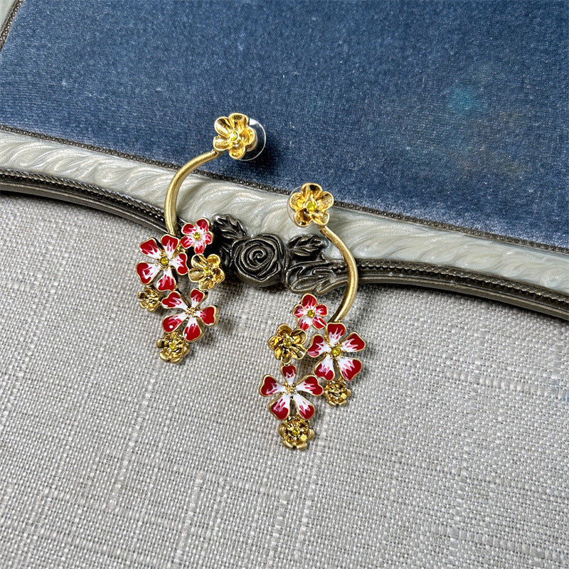 Long enamel flower hoop drop stud earrings with red petals and gold accents