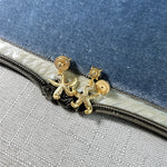 Gold starfish charm studs with circular back caps