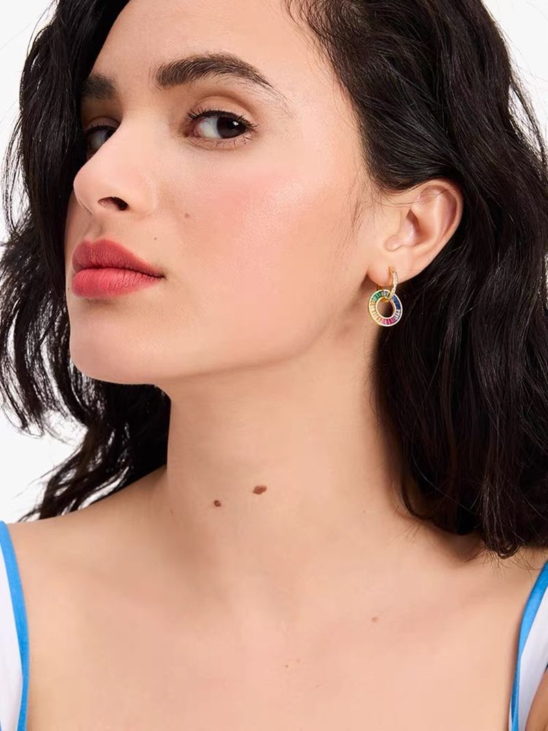Rainbow zircon donut hoop earrings on model, gold-tone frame with multicolor stones