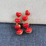 Smooth heart-shaped long drop earrings, glossy red heart drops with gold-tone links