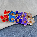 Enamel floral stud earrings mix: red, deep blue, purple, and white petals with gold-tone