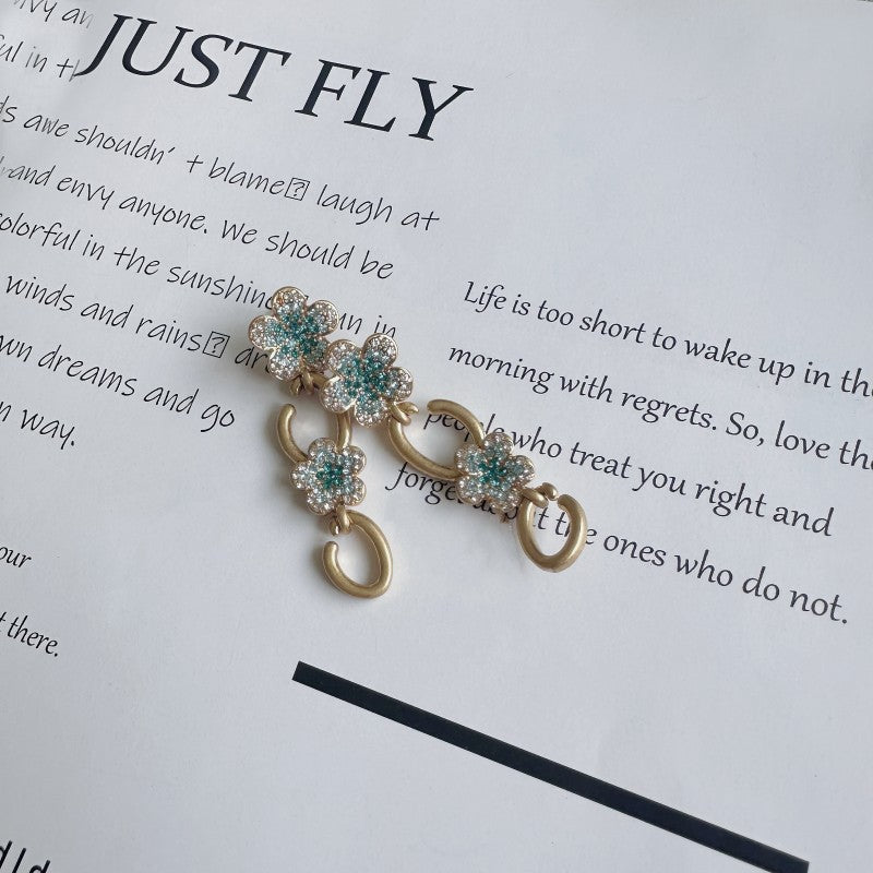 Gold floral drop earrings with teal and clear crystals and double hoop links