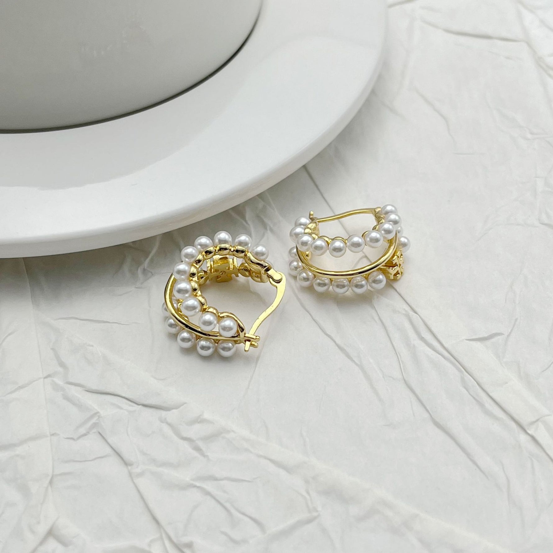 Faux pearl multi-hoop earrings with gold-tone open ring detail