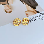 Gold-tone round openwork logo stud earrings, pair with detailed metal cutouts