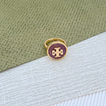 Round enamel metal ring with purple shell center and gold-tone bezel