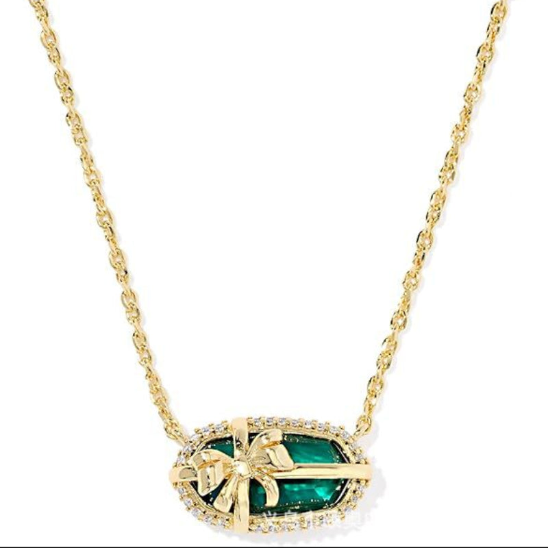 Elisa bow pendant necklace with teal center, gold chain and pavé accents