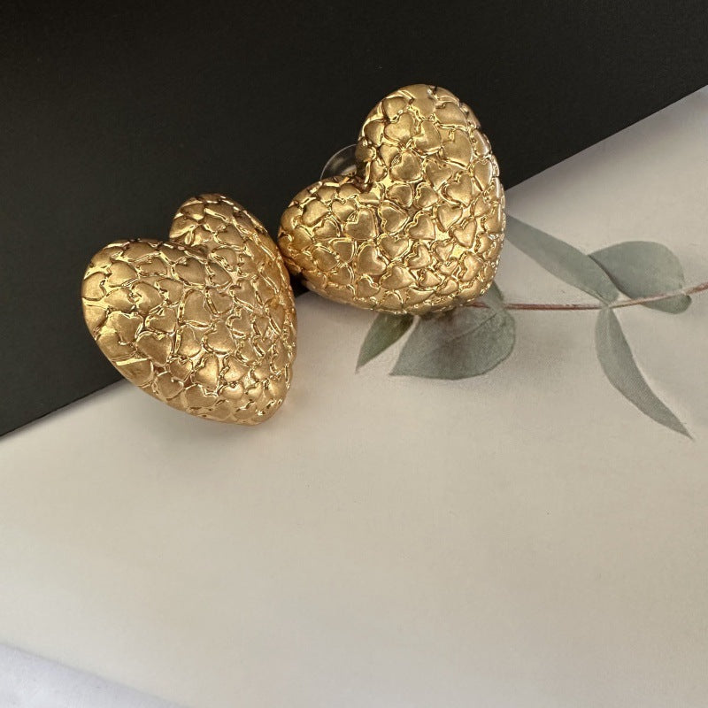 Gold textured heart clip-on earrings, vintage-print heart front pair