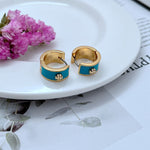Gold-tone enamel geometric hoop earrings, blue enamel with gold trim